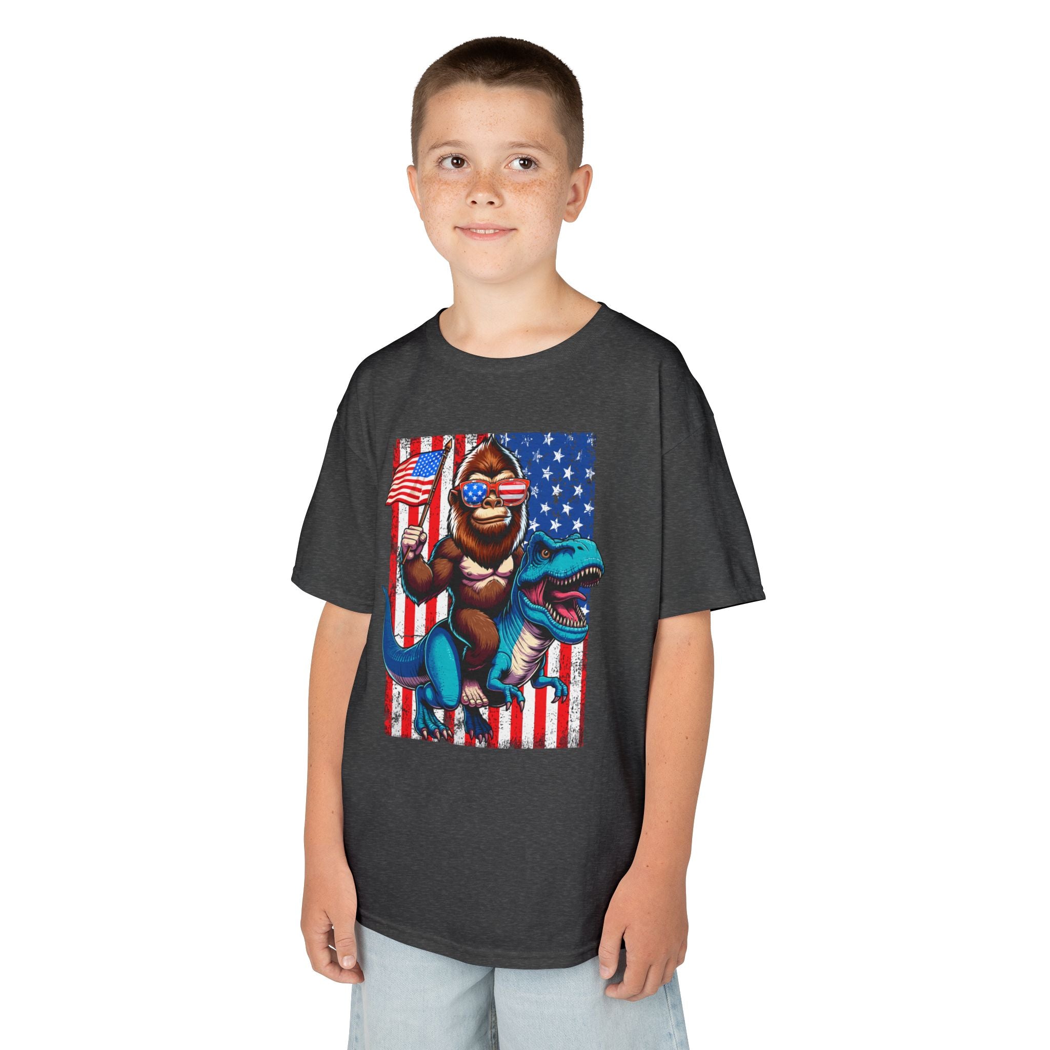 Kids Patriotic Dino Tee – T-Rex Riding Dinosaur with American Flag | Cr8tive Designs