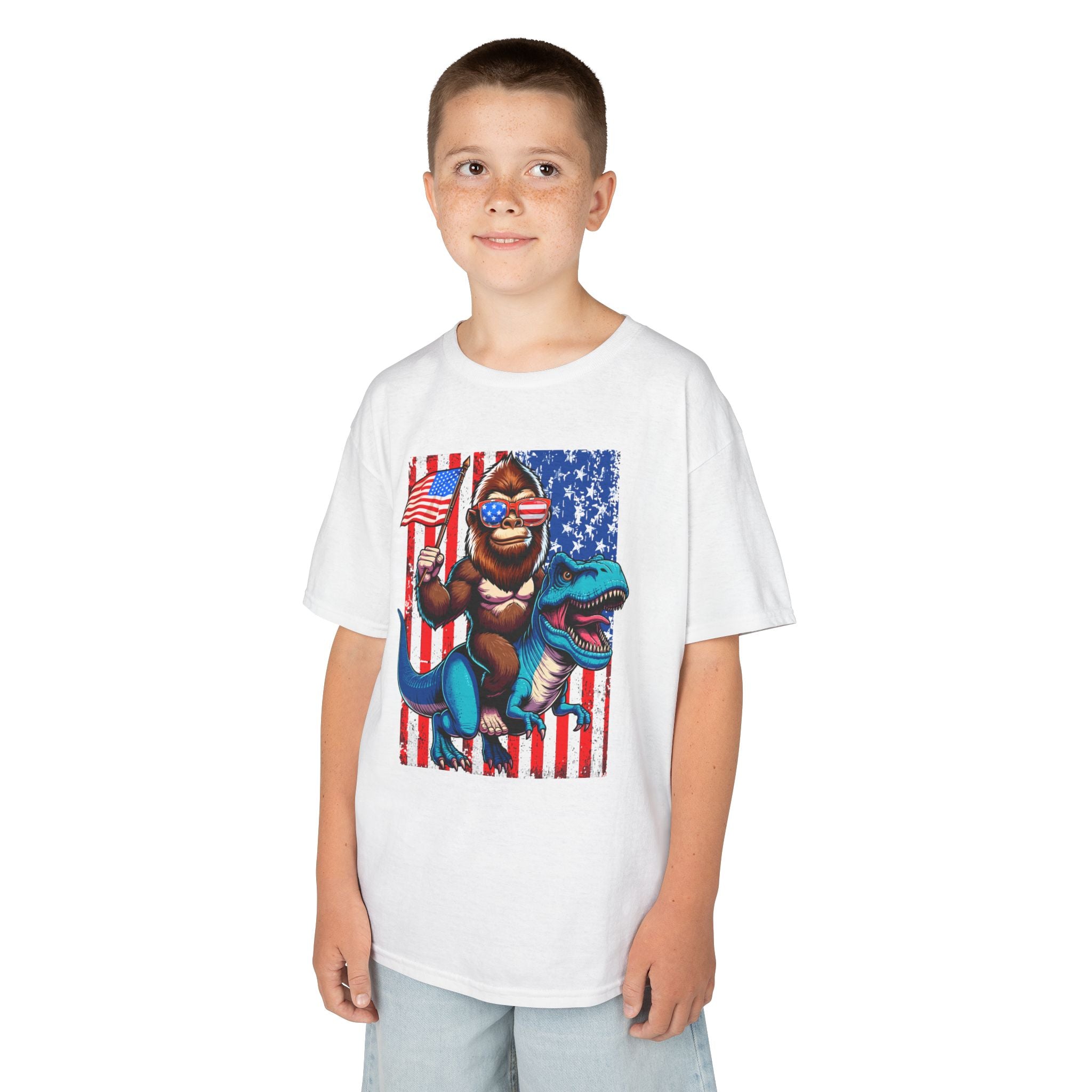 Kids Patriotic Dino Tee – T-Rex Riding Dinosaur with American Flag | Cr8tive Designs