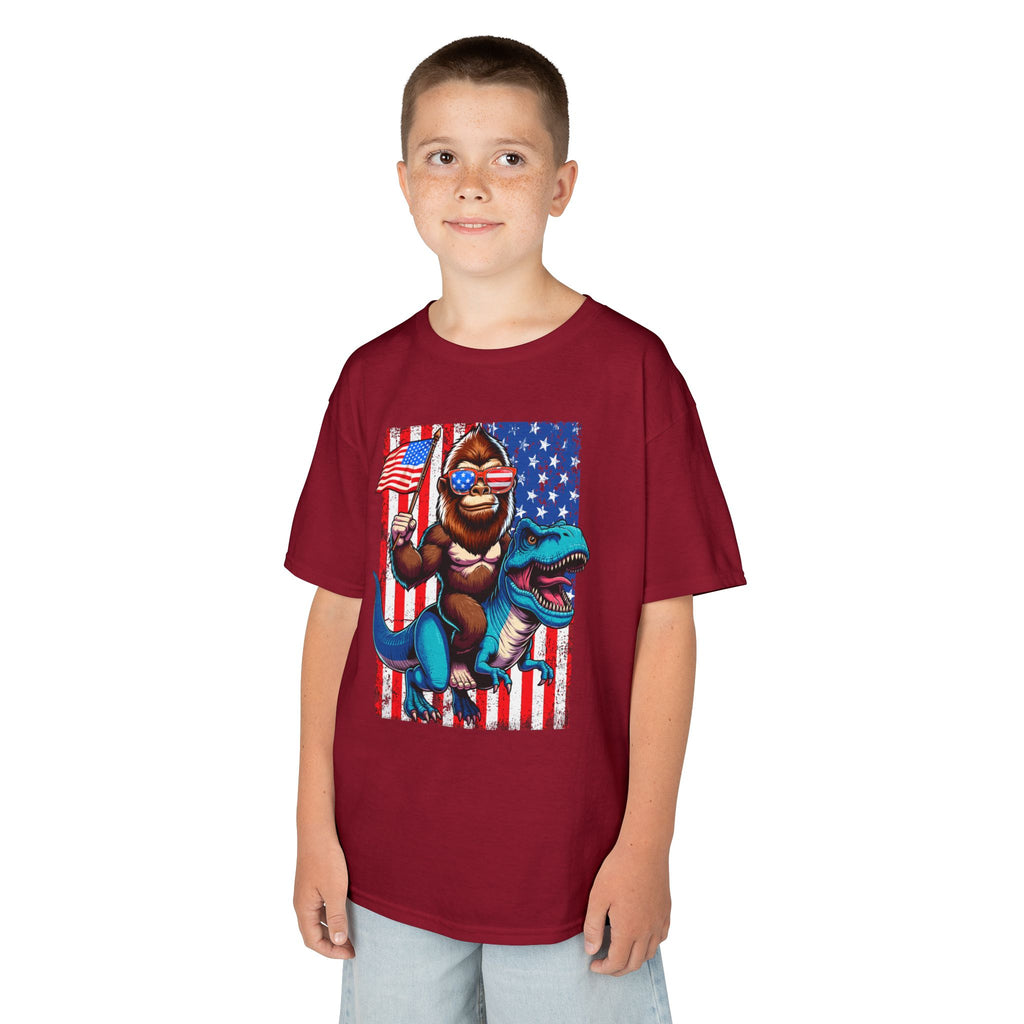 Kids Patriotic Dino Tee – T-Rex Riding Dinosaur with American Flag | Cr8tive Designs