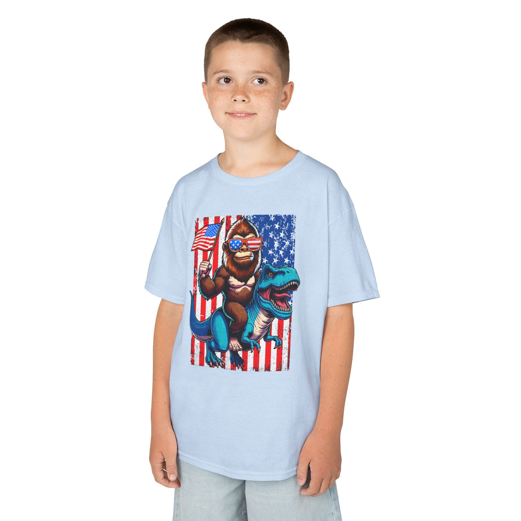 Kids Patriotic Dino Tee – T-Rex Riding Dinosaur with American Flag | Cr8tive Designs